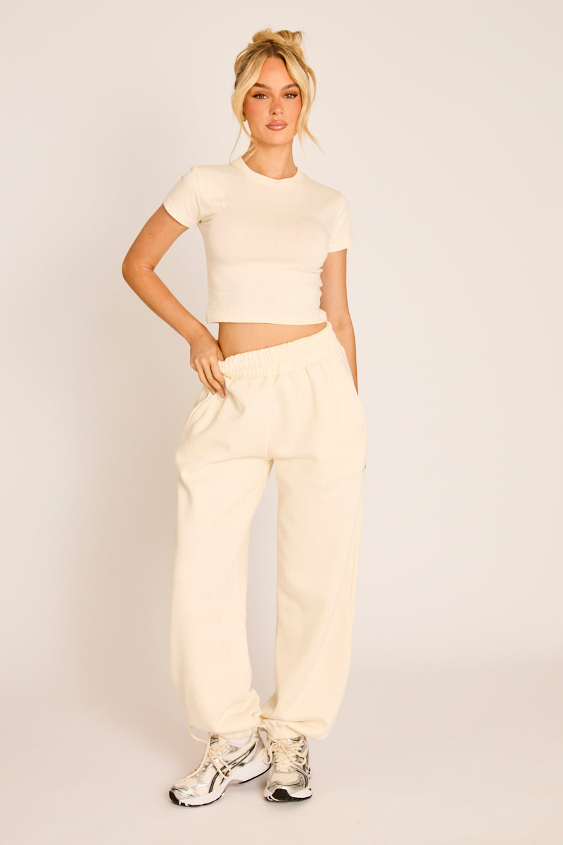 Cream Rebellious Logo Jersey Jogger Trousers - Kynee