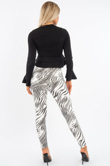 Black Peplum Frill Long Sleeve Top - Fari-Tops