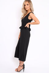 Black Plunge Neck Frill Waist Culottes Jumpsuit - Camille-Jumpsuits