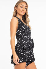 Black Polka Dot Halter Neck Ruffle Playsuit - Kallee-Playsuits