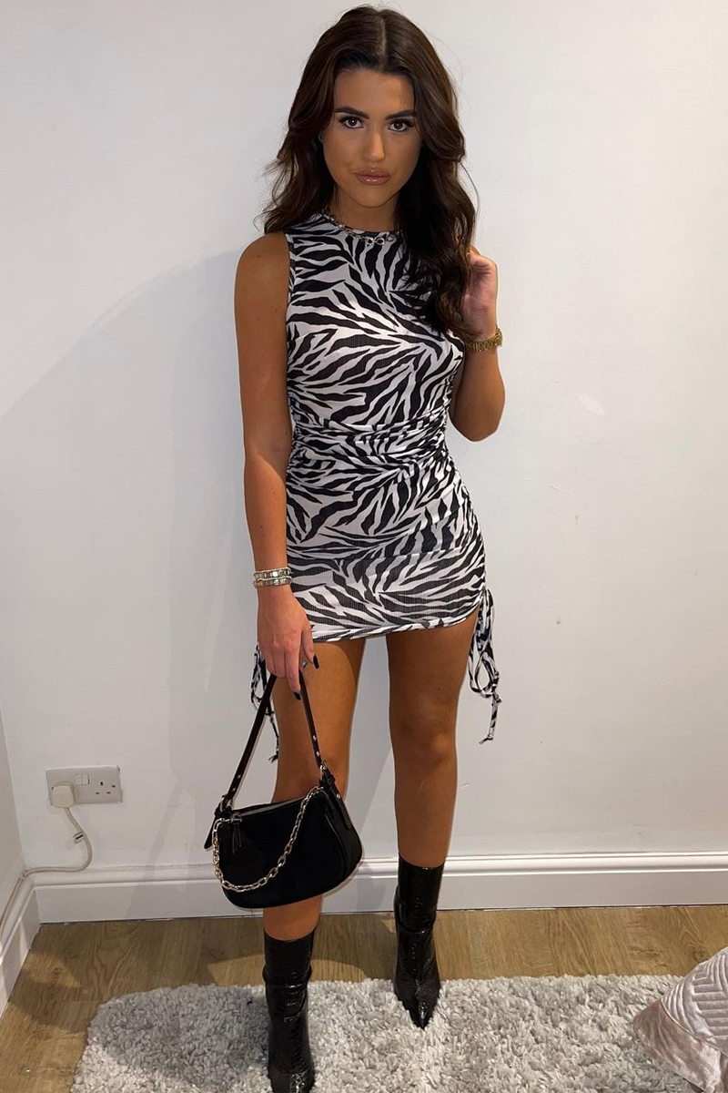 zebra mini dress Zuelle Bodycon in Horizontal Black and White Amplify its direct appeal by pairing with sleek black knee high boots and a coordinating clutch bag for an entrance thats undeniably impactful. Valorie Halter Mini Dress Zebra